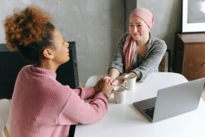 a woman holding her hands with her friend