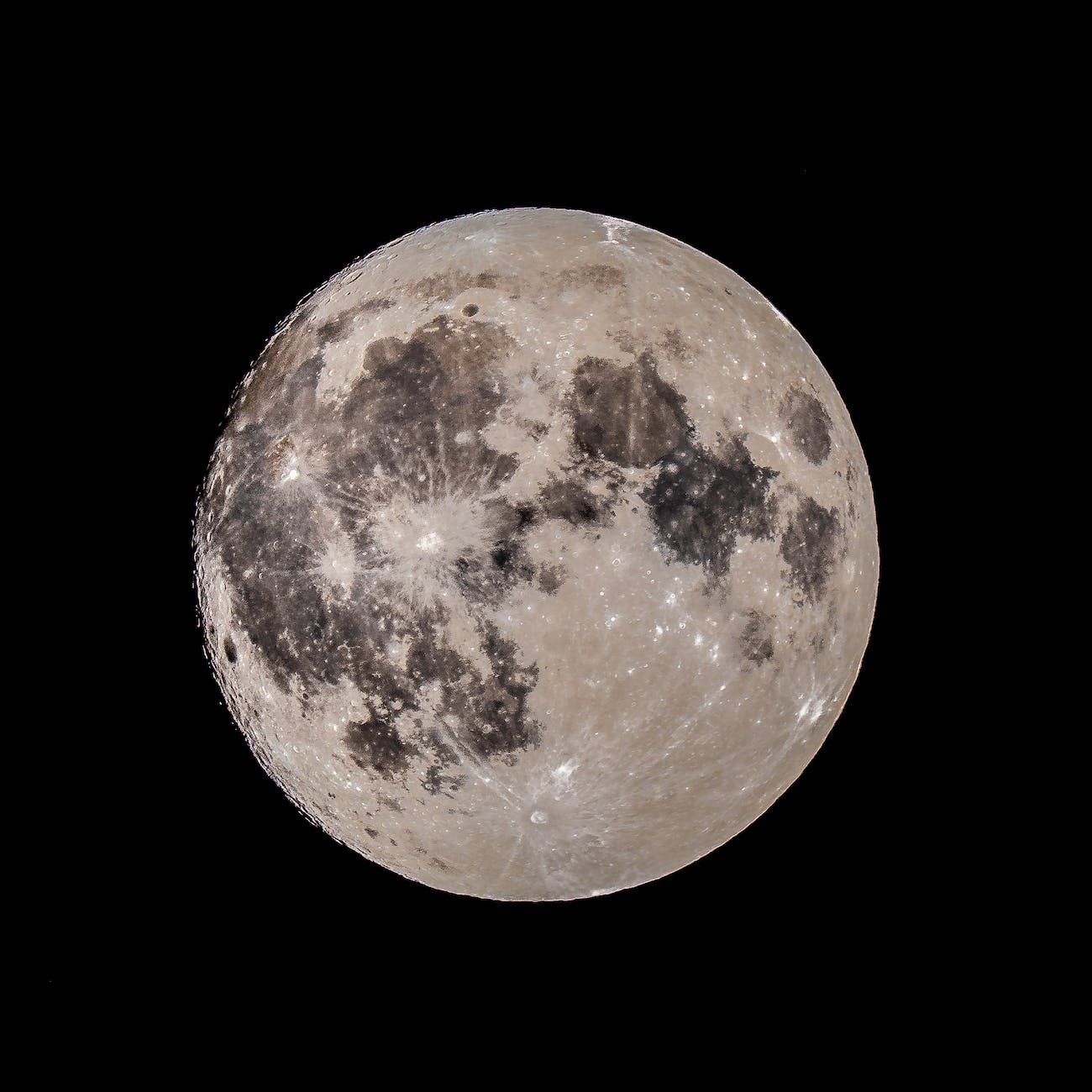 bright supermoon shining in dark night sky